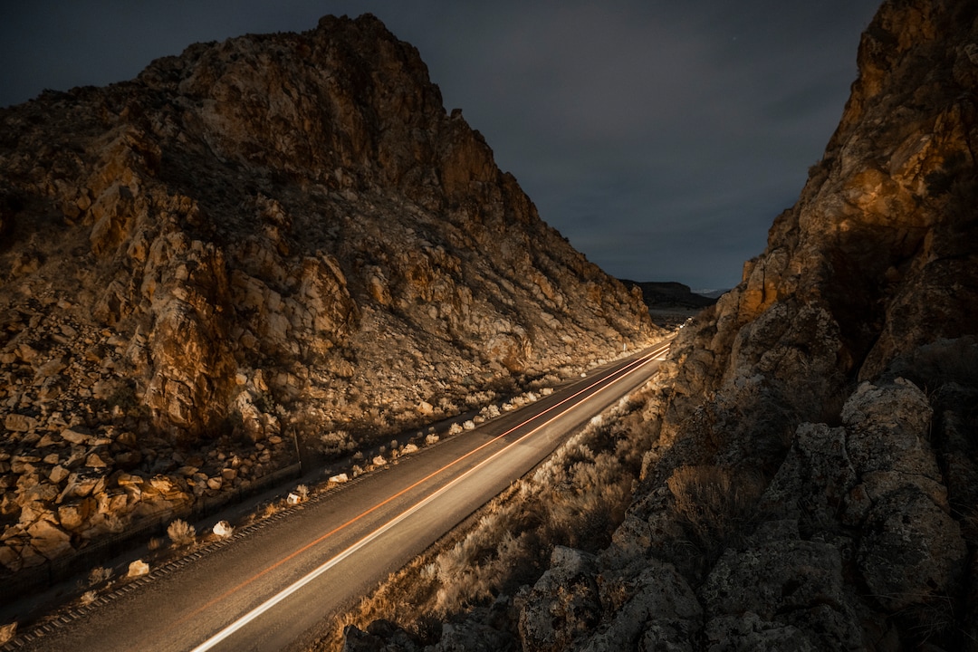 (Leah Hogsten | The Salt Lake Tribune)  A car's headlights and break lights illuminate the Parowan Gap, the night before the spring equinox, Mar. 19, 2021. According to the Utah Geological Survey, the Parowan Gap, formed millions of years ago is a classic example of a wind gap, where an ancient river cut a 600-foot deep notch through the Navajo Sandstone of the Red Hills. The Gap is believed to have the most concentrated collections of petroglyphs in the West, dating back some 5,000 years with over 90 panels featuring some 1,500 figures.