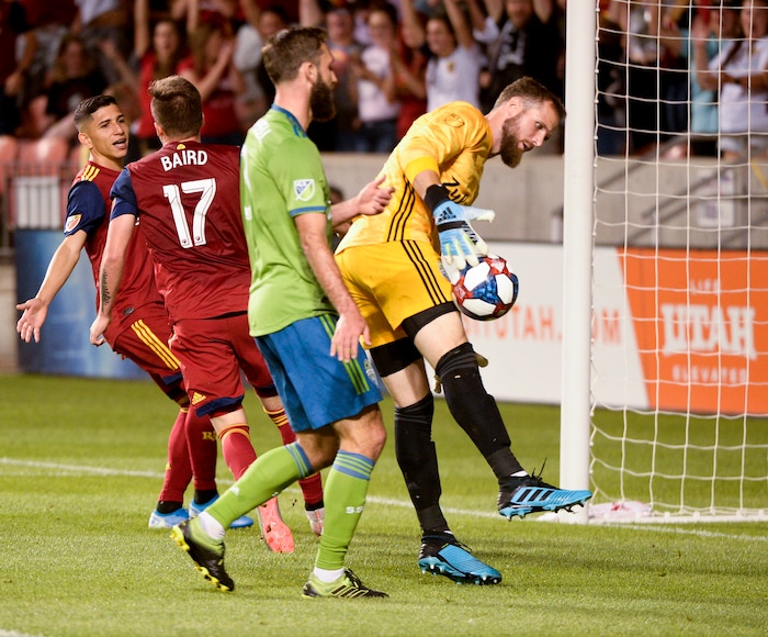 (Leah Hogsten  |  The Salt Lake Tribune)  Real Salt Lake forward Corey Baird (17) kicks in the team's third goal on Seattle Sounders goalkeeper Stefan Frei (24) as Real Salt Lake hosts the Seattle Sounders, Aug. 14, 2019, at Rio Tinto Stadium in Sandy. RSL defeated the Sounders 3-0.