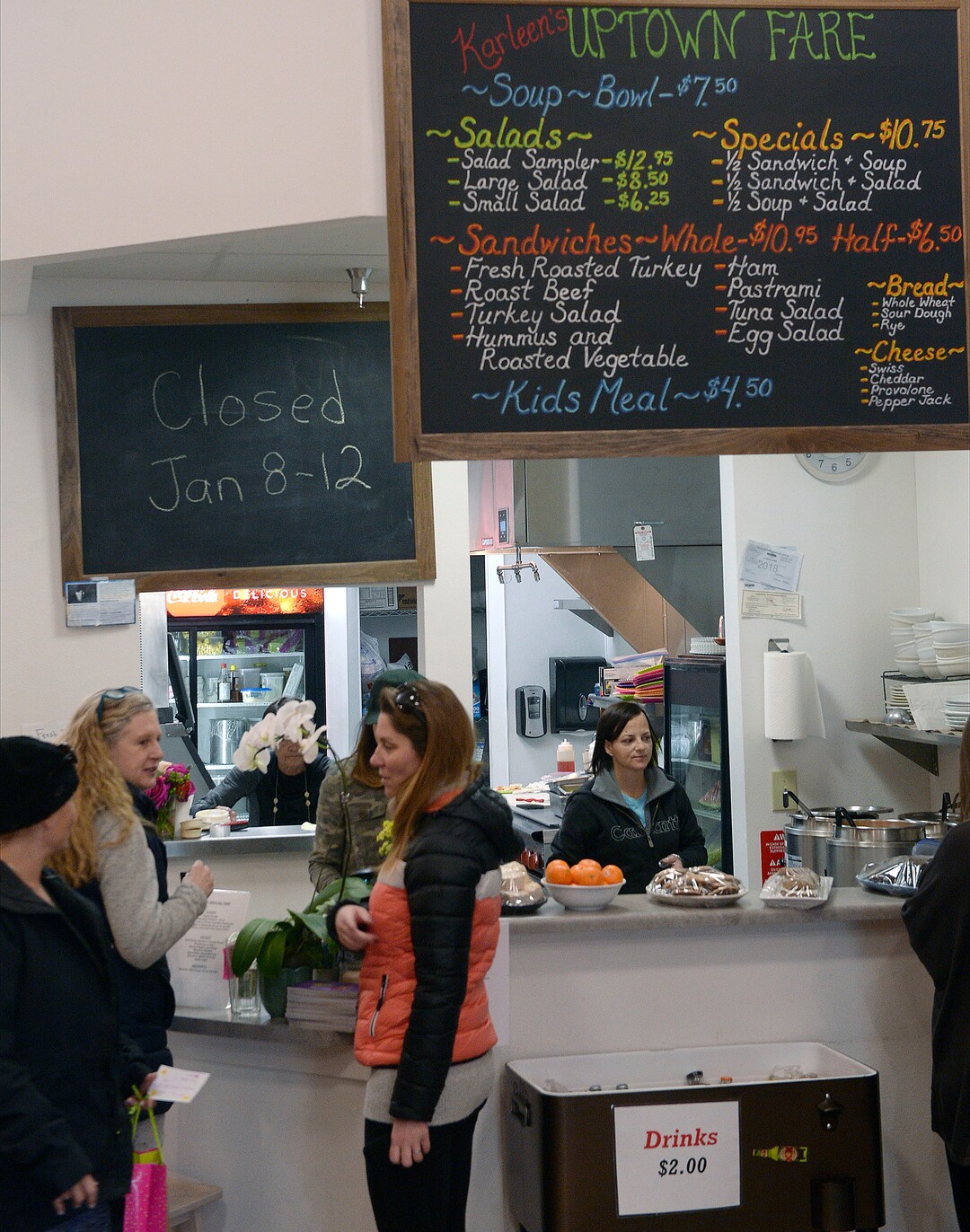 (Al Hartmann  |  The Salt Lake Tribune) Friends meet at the counter at Uptown Fare in Park City.