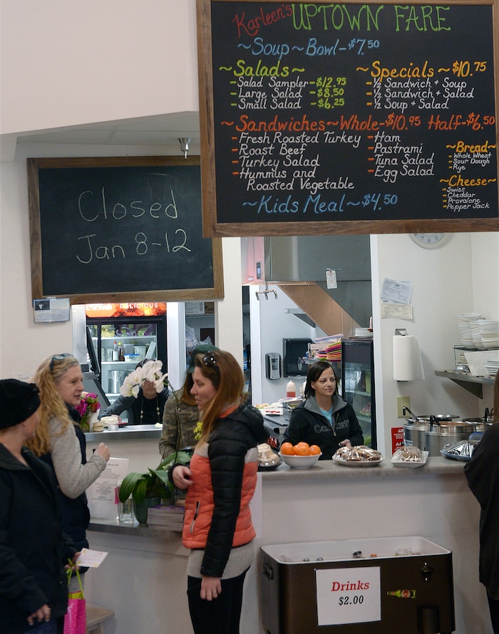 (Al Hartmann  |  The Salt Lake Tribune) Friends meet at the counter at Uptown Fare in Park City.