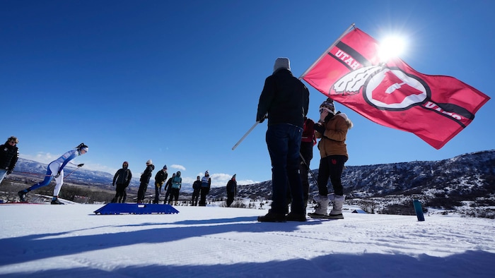 (Francisco Kjolseth | The Salt Lake Tribune) University of Utah fans cheer on the athletes during the women’s 5K classic in the NCAA Skiing Championships held at the Soldier Hollow Nordic Center on Thursday, March 10, 2022 in Midway, Utah. 

