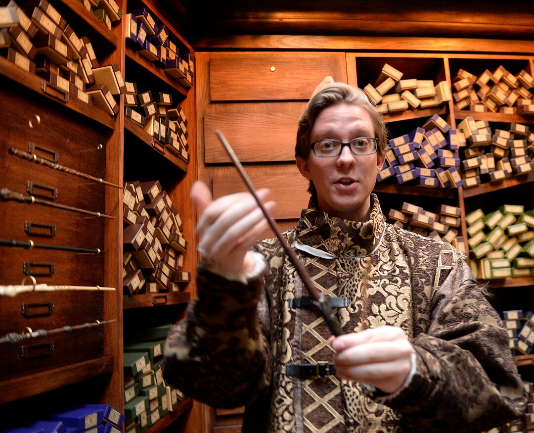 (Al Hartmann  |  The Salt Lake Tribune) 	
Deven Skaggs, wand apprentice describes the qualities of Harry Potter's wand inside Ollivander's wand shop at Warner Bros. Harry Potter-themed exhibit and shopping area in the Shops at South Town in Sandy. There are interactive activities in addition to "Harry Potter" and "Fantastic Beasts" merchandise.