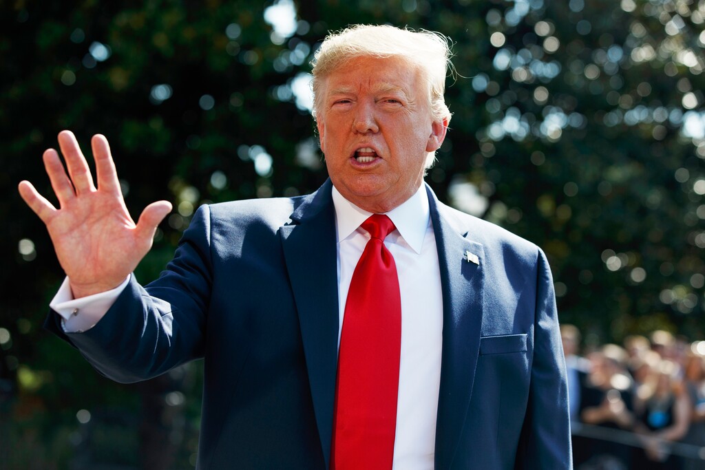 (Evan Vucci | AP Photo) President Donald Trump talks to reporters on the South Lawn of the White House, Friday, Aug. 9, 2019, in Washington, as he prepares to leave Washington for his annual August holiday at his New Jersey golf club.
