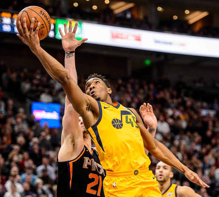 (Trent Nelson | The Salt Lake Tribune)  Utah Jazz guard Donovan Mitchell (45) shoots as the Utah Jazz host the Phoenix Suns, NBA basketball in Salt Lake City, Wednesday Feb. 14, 2018.