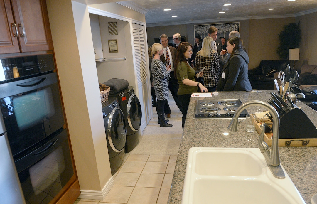 (Al Hartmann  |  The Salt Lake Tribune) 	People gather for the opening at a residential house in Murray for a new sober living housing program Monday Jan. 29.  The combined county and state funded program places people in safe, affordable housing while continuing to receive treatment for substance use.  The residential home is now open in Murray providing space for 12 residents