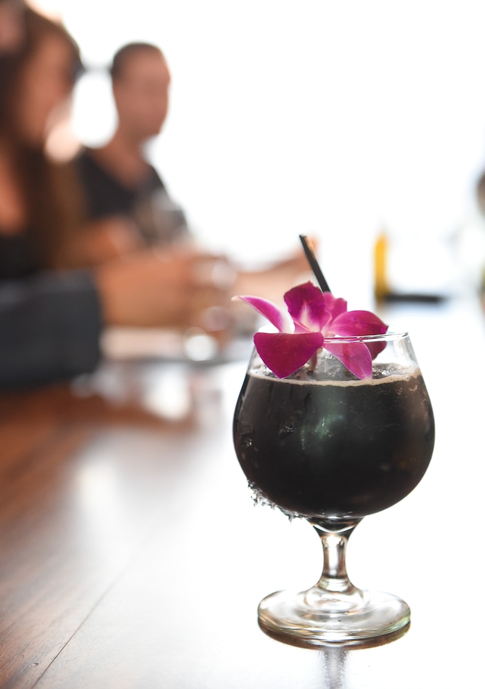 (Francisco Kjolseth  |  The Salt Lake Tribune)  The 'Dark Crysal,' made with rye whiskey, turkish rhubarb, activated charcoal and lime is the creation bartender Crystal Daniels who is a fan of the 1982 film The Dark Crystal by Jim Henson at the Post Office Place, a new bar by the same owners as Takashi, located next door.