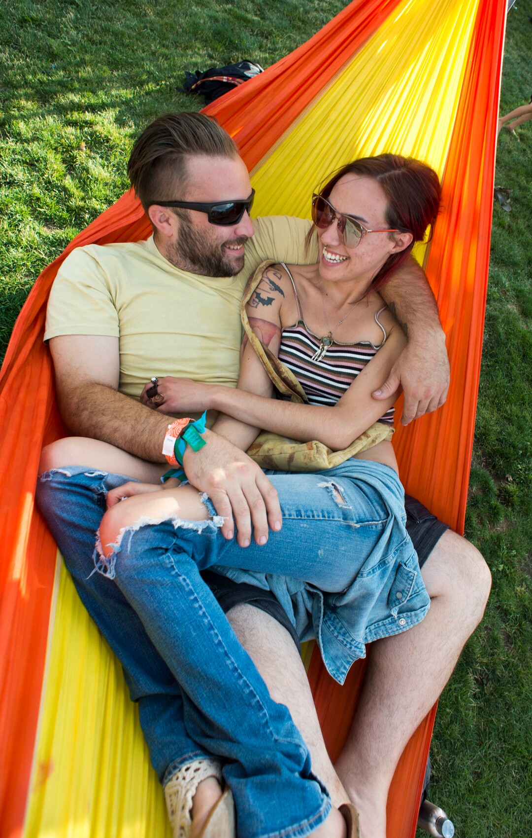 (Rick Egan  |  The Salt Lake Tribune)       Bill Doughtery from Coalville and Marie Marra from West Milford New Jersey, relax in a hammock, on the opening day of the 3-day Reggae Rise Up Festival at the Rivers Edge in Heber City, Friday, Aug. 24, 2018.