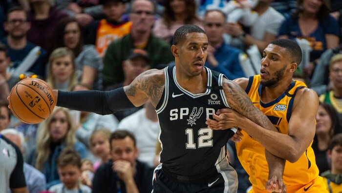 (Rick Egan  |  The Salt Lake Tribune)    
San Antonio Spurs forward LaMarcus Aldridge (12) keeps the ball from Utah Jazz center Tony Bradley (13), in NBA action between the Utah Jazz and the San Antonio Spurs, in Salt Lake City, Friday, Feb. 21, 2020.