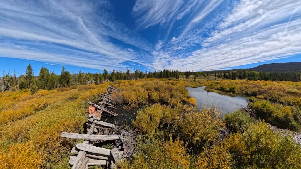 (Francisco Kjolseth | The Salt Lake Tribune) Mike Fiorelli  with Trout Unlimited stands on the remnants of a “splash dam,” once used to build up enough water in the spring to release freshly cut railroad ties from the Bear River headwaters to Evanston Wyoming for the building of the Transcontinental Railroad, Wednesday, Sept. 9, 2026.