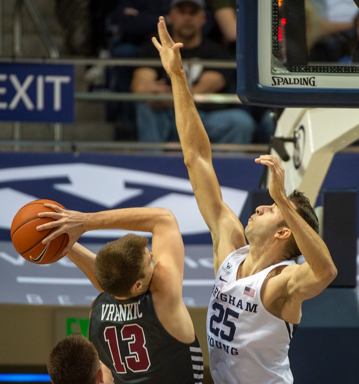 (Rick Egan  |  The Salt Lake Tribune)       Santa Clara Broncos forward Josip Vrankic (13) tries to get a shot over Brigham Young Cougars forward Gavin Baxter (25), in basketball action between Brigham Young Cougars and Santa Clara Broncos at the Marriott Center in Provo, Saturday, Jan. 12, 2019.


