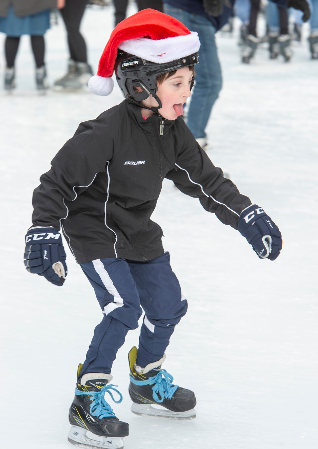 (Rick Egan  |  The Salt Lake Tribune) Evelyn Lambson, 8, of Stansbury Park, takes a break from hockey practice as she skates at the Gallivan Center ice rink on Christmas Eve, Tuesday, Dec. 24, 2019.