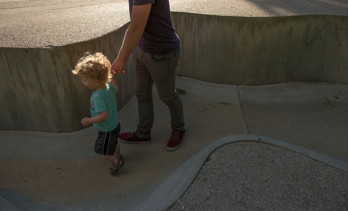 Leah Hogsten  |  The Salt Lake Tribune
Xander Nelson tugs on his father Blaine's hands while playin around the dry Seven Canyons fountain, Friday, May 26, 2017.
Liberty Park's Seven Canyons fountain will not be operational for 2017.  