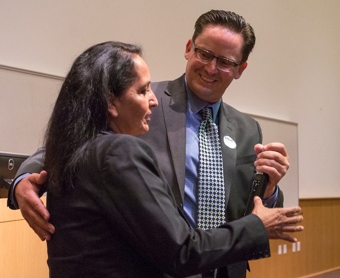 (Rick Egan  |  The Salt Lake Tribune)  Salt Lake County sheriff runner-up Steve Anjewierden hands the microphone to Rosie Rivera Saturday, Aug. 12, 2017, after saying a few words about his supporters.