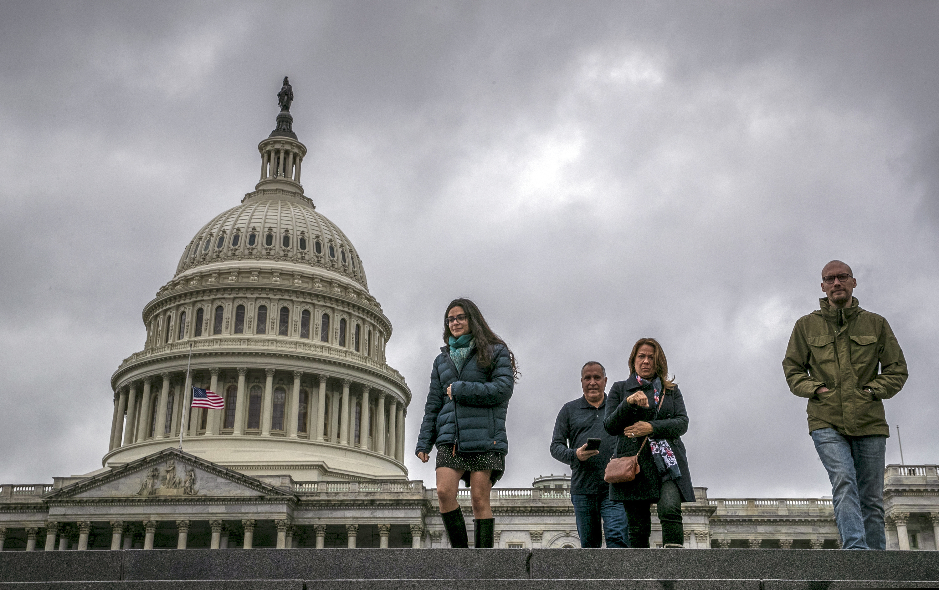 People arrive at the Capitol Visitors Center as work in Congress continues prior to a Friday night funding deadline to avoid a partial government shutdown, in Washington, Friday, Dec. 21, 2018. President Trump is imploring Senate Republican Leader Mitch McConnell to change the Senate's rules in order to pass the spending bill with money for a border wall. (AP Photo/J. Scott Applewhite)