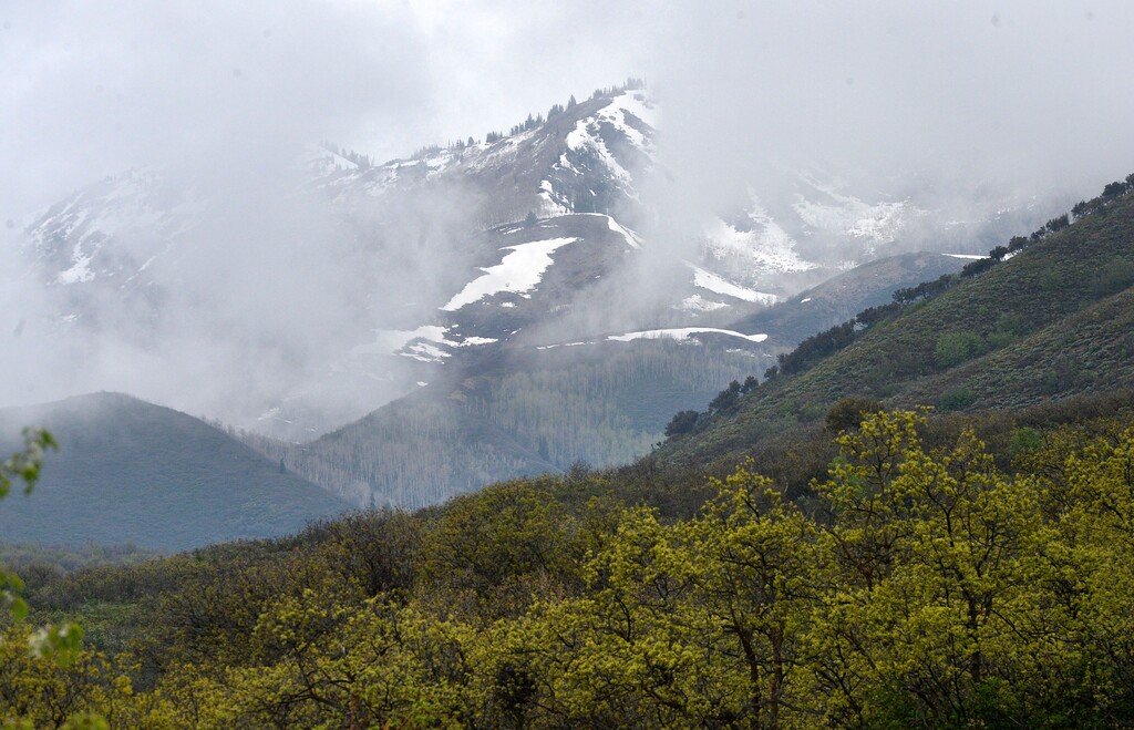 (Al Hartmann  |  The Salt Lake Tribune) Mountains are shrouded in rain clouds above Wasatch State Park near Midway on Monday May 16, 2016. An avalanche near the Snake Creek and Ant Knolls areas of the park left one person dead on Wednesday, Feb. 18, 2026.