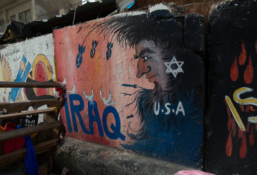 (Nasser Nasser | The Associated Press) Graffiti adorns a wall in Tahrir Square, Baghdad, Iraq, on Wednesday, Jan. 8, 2020. Iran struck back at the United States early Wednesday for killing a top Revolutionary Guard commander, firing a series of ballistic missiles at two military bases in Iraq that house American troops in a major escalation between the two longtime foes. Utah agencies also reported an attempted cyberattack from Iran over the weekend.