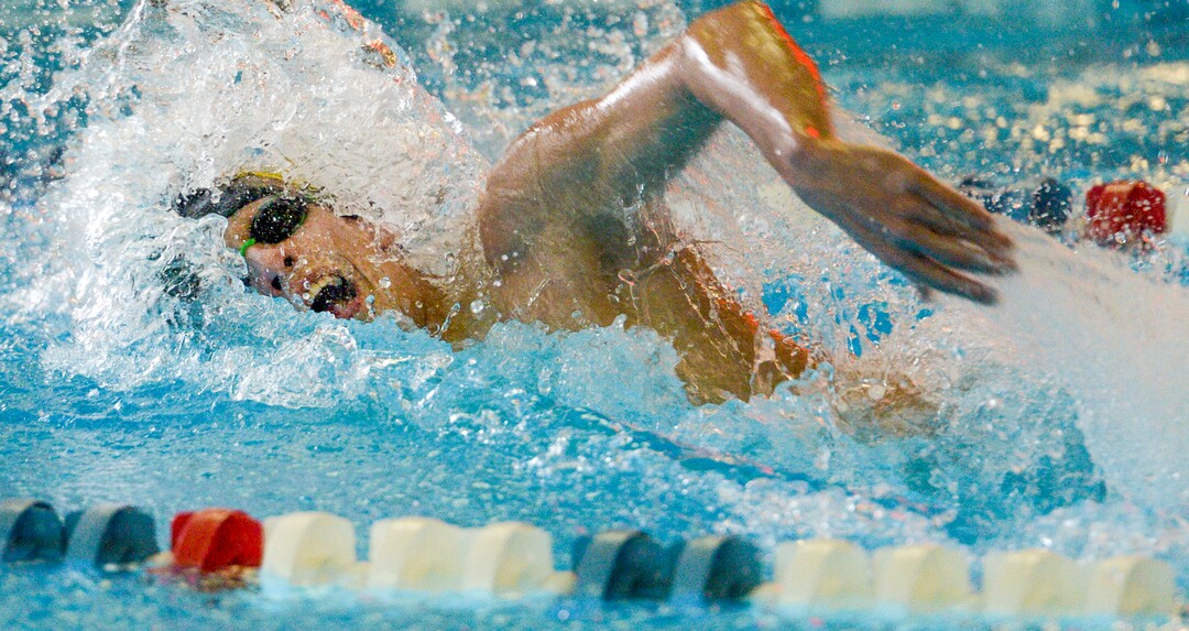 (Leah Hogsten  |  The Salt Lake Tribune)  Christian Simon swims the 110 yard freestyle in 46.38 at the Class 5A State Championships in Bountiful, Saturday, February 10, 2018. 