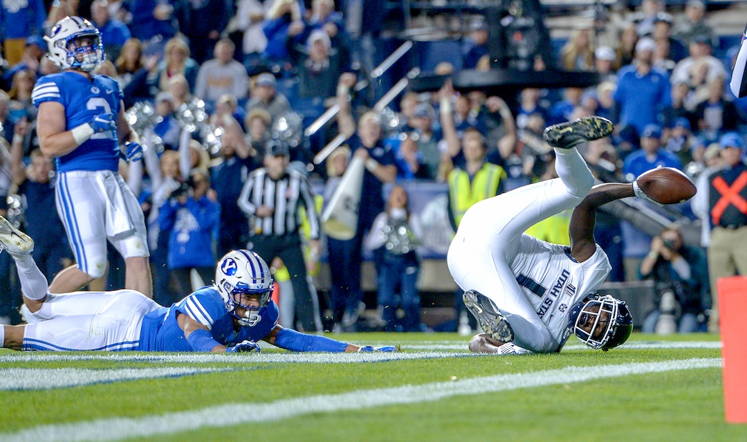 Leah Hogsten  |  The Salt Lake Tribune  Utah State Aggies wide receiver Ron'quavion Tarver (1) with a touchdown in the 2nd quarter as BYU hosts Utah State University at Lavell Edwards Stadium in Provo, Friday, Oct. 5, 2018.