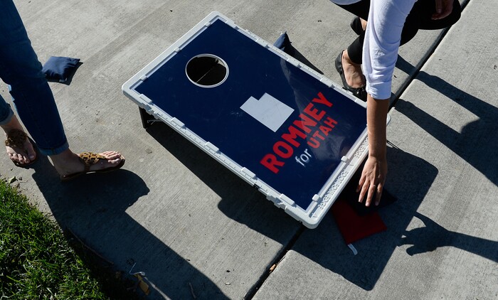 (Francisco Kjolseth | The Salt Lake Tribune) The Romney campaign hosts "Mondays With Mitt" at Veterans Memorial Park in West Jordan on Monday, June 18, 2018, as supporters play a friendly game of bean bag toss before the arrival of Senate candidate Mitt Romney with supporters at the park. .