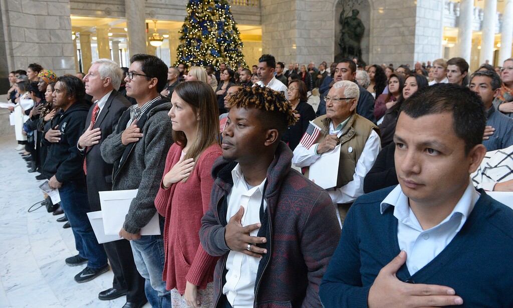 Al Hartmann  |  The Salt Lake Tribune
122 people from 43 countries stand for the national anthem with hands over their hearts at a naturalization ceremony on Nov. 30, 2016, at the Utah Capitol.