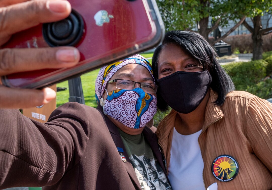 (Leah Hogsten  |  The Salt Lake Tribune) Betty Sawyer, longtime communty activist from Ogden and member of the Utah Coalition To Abolish Slavery snaps a photo with Rep. Sandra Hollins, D-Salt Lake City, on the Capitol lawn Tuesday. A coalition of politicians, religious leaders and civil rights activists are urged Utahns to pass Amendment C on the ballot to remove old wording in the state constitution, Sept. 22, 2020, that they say still allows slavery as a punishment for crime.