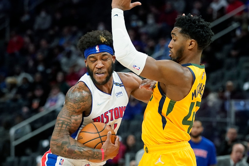 Detroit Pistons forward Saddiq Bey runs into Utah Jazz guard Donovan Mitchell (45) during the first half of an NBA basketball game, Monday, Jan. 10, 2022, in Detroit. (AP Photo/Carlos Osorio)