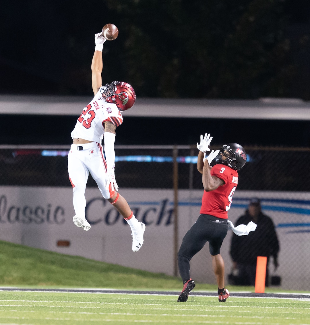 Utah Utes defensive back Julian Blackmon (23) goes up high to deflect a pass intended for NIU Huskies wide receiver Jauan Wesley (9) during a college football game at Huskie Stadium in DeKalb, IL on Saturday, Sept. 8, 2018 (Sean King | for The Salt Lake Tribune)