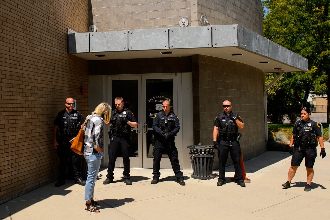 (Trent Nelson  |  The Salt Lake Tribune)  Police stand guard after a meeting of an inland port satellite working group was quickly canceled. The meeting was held at a police precinct in Salt Lake City on Wednesday Aug. 14, 2019.
