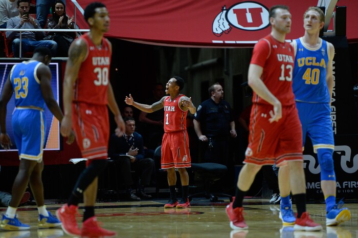(Francisco Kjolseth  |  The Salt Lake Tribune)  Utah Utes guard Justin Bibbins (1) celebrates with the fans for the win as the University of Utah hosts UCLA in NCAA basketball at the Huntsman Center in Salt Lake City, Thursday, Feb. 22, 2018.