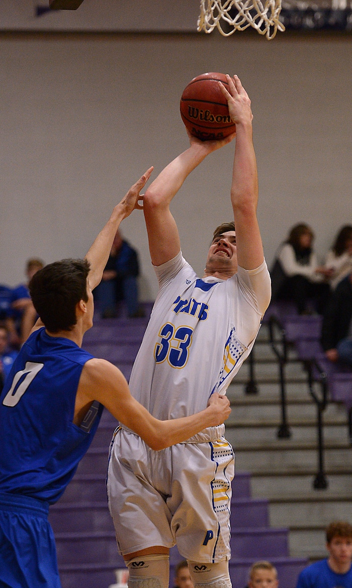 (Leah Hogsten  |  The Salt Lake Tribune) Cyprus' Noah Burbidge hits the net over Dixie's Derek Cox. Dixie High School defeated Cyprus High School boys' basketball team 59-52 during the Riverton Holiday Tournament in Riverton, December 28, 2017. 