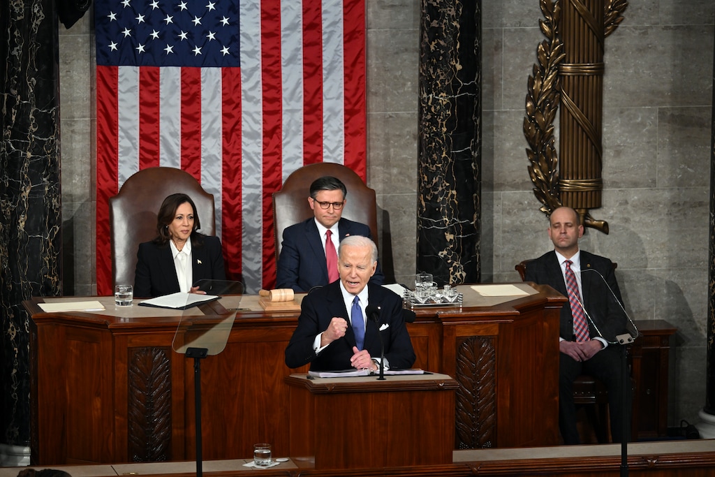 (Kenny Holston | The New York Times) President Joe Biden delivers the State of the Union address to a joint session of Congress at the U.S. Capitol in Washington, on March 7, 2024. Looking on are Vice President Kamala Harris and House Speaker Mike Johnson, R-La.