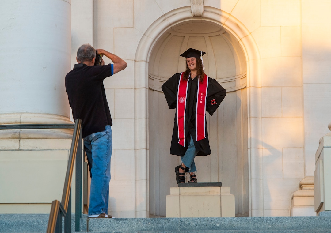 (Rick Egan  |  The Salt Lake Tribune)    Tom Bonacci snaps a photo of his daughter Katy Bonacci in front of the Park Building at the University of Utah, Thursday April 30, 2020