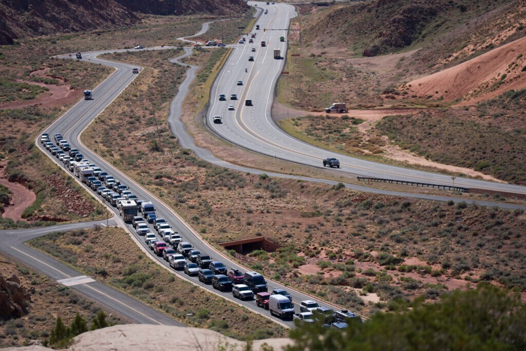 (Bethany Baker | The Salt Lake Tribune) Tourists line up to enter Arches National Park near Moab on Thursday, April 9, 2026.