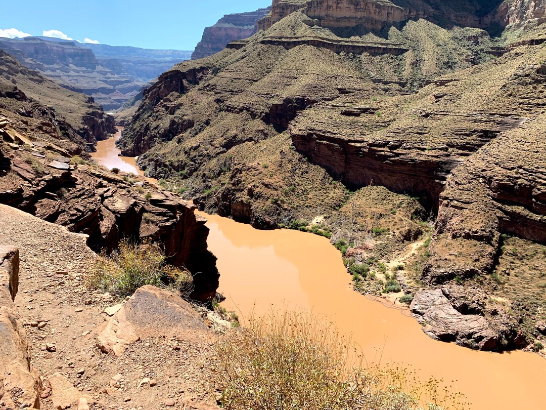 (Judy Fahys  |  InsideClimate News) Scientists have been studying the Colorado River, shown here from above Deer Creek Falls, for nearly four decades to understand the environmental impacts of the Glen Canyon Dam on a water source used by around 40 million people in seven states. The environment, climate change, tribal rights and those water users will all be considered in river-management talks expected to begin later this year.