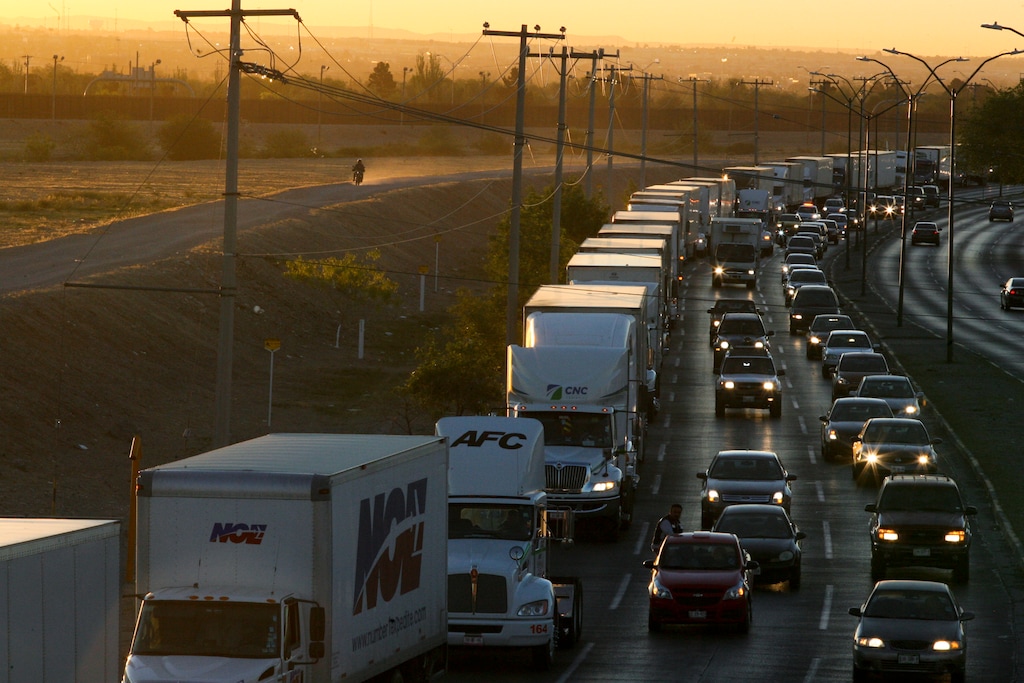 (Christian Torres | AP file photo) Trucks wait to cross the border with the U.S. in Ciudad Juarez, Mexico. In a surprise announcement that could compromise a major trade deal, President Donald Trump announced Thursday that he is slapping a 5% tariff on all Mexican imports to pressure the country to do more to crack down on the surge of Central American migrants trying to cross the U.S. border.
