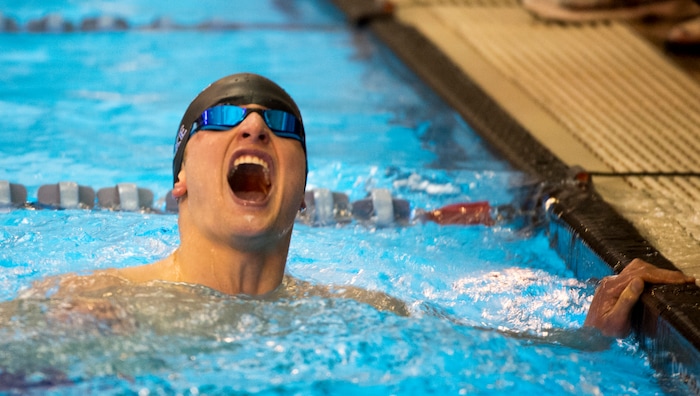 (Rick Egan  |  The Salt Lake Tribune)    Pleasant Grove Swimmer, Devin Bunnell celebrates his first place finish in the Men's 500 Yard Freestyle, in 6A State Swimming Championships in Bountiful, Friday, February 9, 2018.