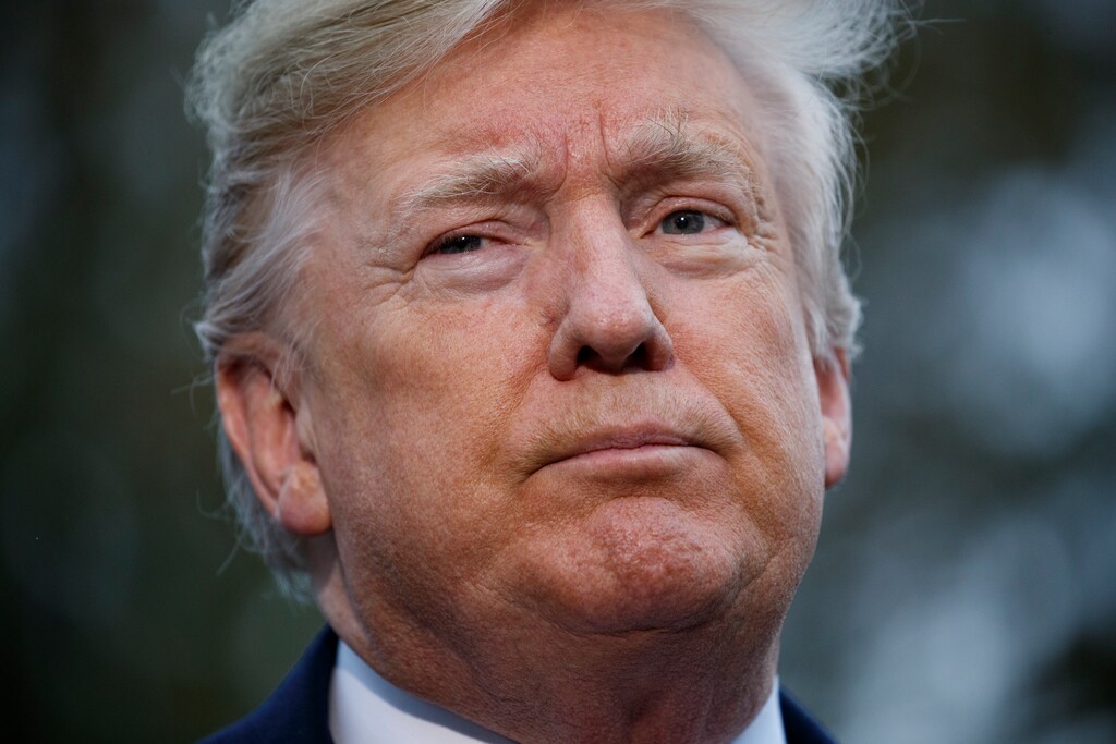 (Evan Vucci | The Associated Press) President Donald Trump talks with reporters before departing for France on the South Lawn of the White House, Friday, Nov. 9, 2018, in Washington.