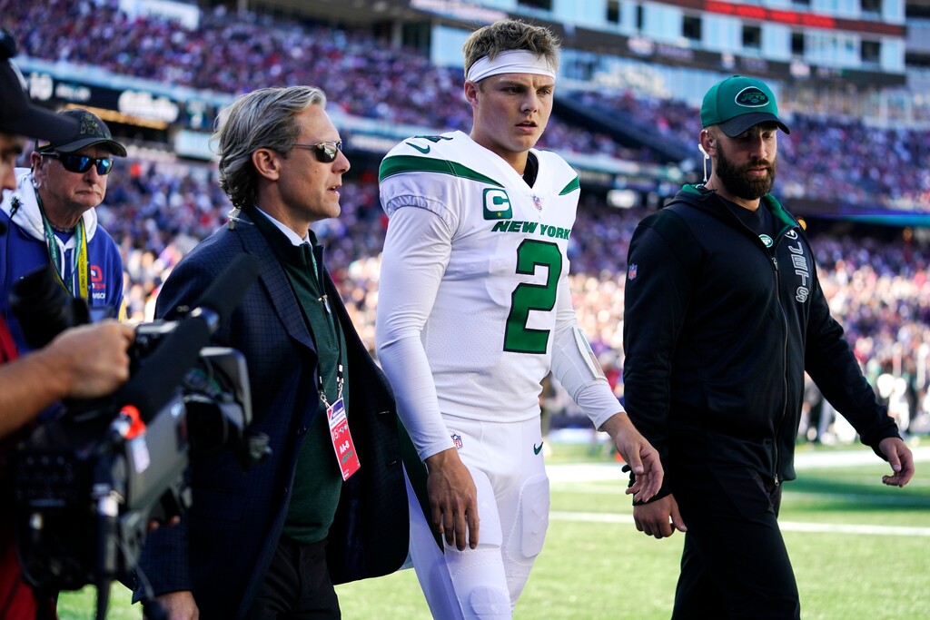 (Steven Senne | AP) New York Jets quarterback Zach Wilson (2) leaves during the first half of an NFL football game against the New England Patriots, Sunday, Oct. 24, 2021, in Foxborough, Mass.
