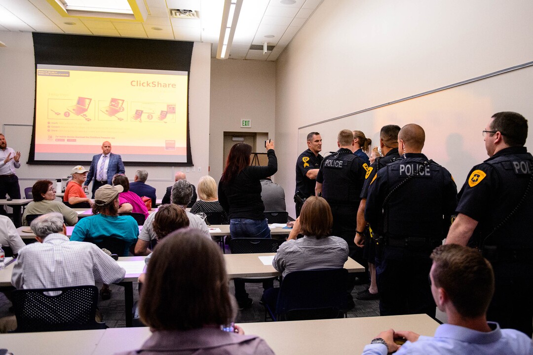 (Trent Nelson  |  The Salt Lake Tribune)  
Ethan Peterson argues with police who are removing him from a meeting of an inland port satellite working group held at a police precinct in Salt Lake City on Wednesday, Aug. 14, 2019. The meeting was quickly canceled soon after it began.