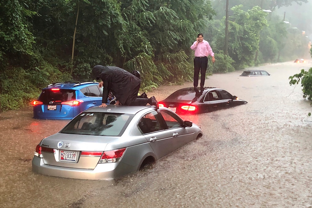 Motorists are stranded on a flooded section of Canal Road in Washington during a heavy rainstorm, Monday, July 8, 2019. (Dave Dildine/WTOP via AP)