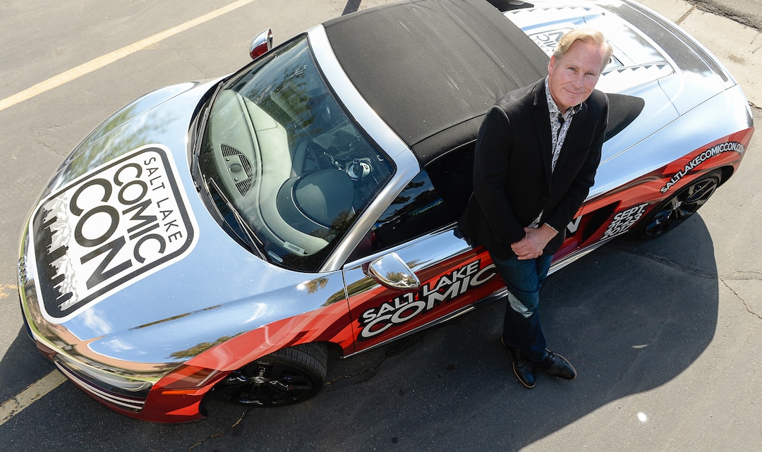 (Francisco Kjolseth  |  The Salt Lake Tribune)  Dan Farr co-founder of Salt Lake Comic Con stands by one of their more noticeable marketing tools, a chrome wrapped Audi R8. 