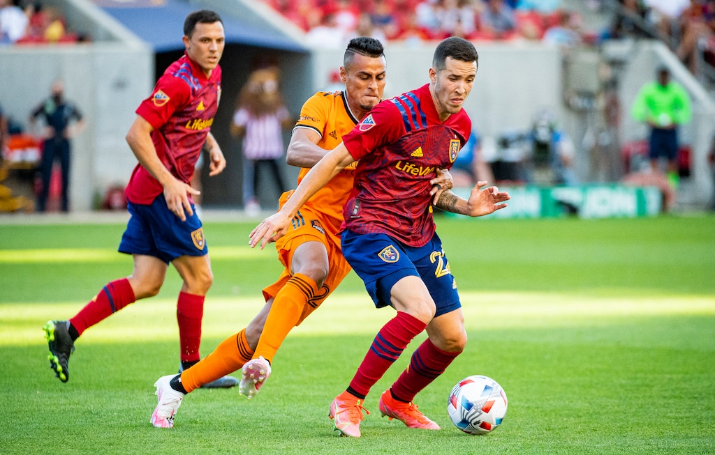 (Isaac Hale | Special to The Tribune) Real Salt Lake defender Aaron Herrera (22) and Houston Dynamo midfielder Darwin Ceren (24) compete for possession of the ball during a MLS game between Real Salt Lake and Houston Dynamo FC at Rio Tinto Stadium in Sandy on Saturday, June 26, 2021.