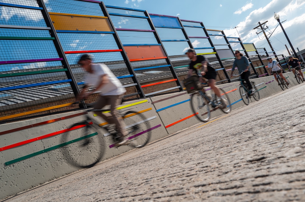 (Trent Nelson | The Salt Lake Tribune) Cyclists pass Strut, the artwork accompanying the path over the 400 South Viaduct Trail in Salt Lake City on Wednesday, May 27, 2026.