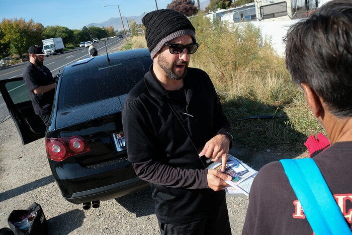 (Francisco Kjolseth  |  The Salt Lake Tribune)  Patrick Rezac, Executive Director of One Voice Recovery, checks in with Ivan Vasquez, 58, who is homeless and a heroin user in West Salt Lake recently. In an effort to curb the incidents of hepatitis C, HIV and STD's, Rezac's grass roots team hands out disease prevention kits and provides a needle exchange program.