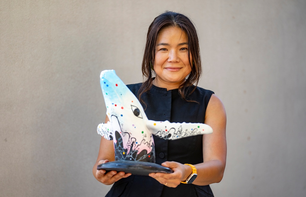 (Rick Egan | The Salt Lake Tribune) Artist Jiyoun Lee Lodge holds a model of the whale's next look is unveiled on 801 day, on Saturday, Aug. 1, 2026.