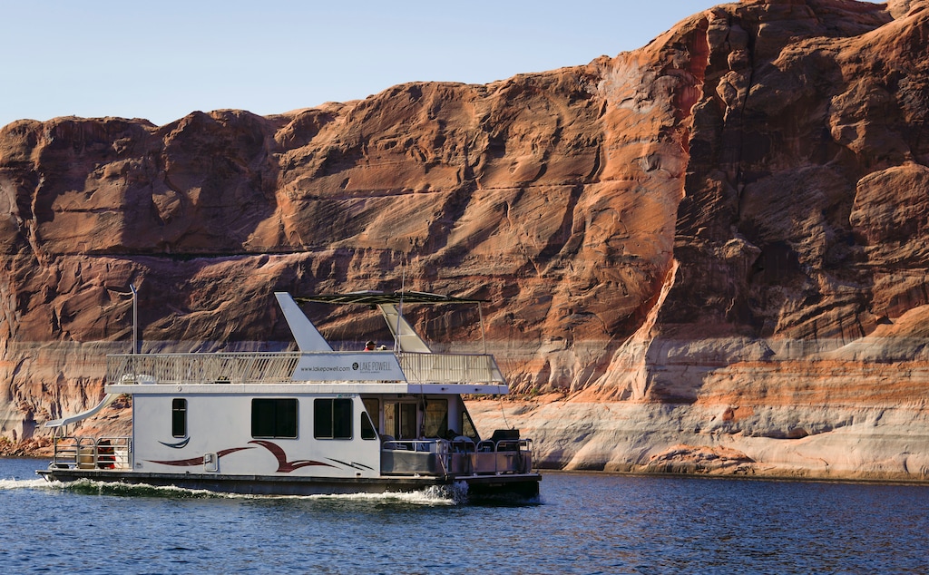 (Bethany Baker | The Salt Lake Tribune) A houseboat is seen at Lake Powell near Ticaboo, Utah on Tuesday, Oct. 17, 2023.