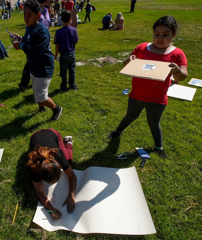(Steve Griffin  |  The Salt Lake Tribune) Meadowlark Elementary School students use a pinhole projector as they draw the outline of the sun as the watch The Great Eclipse during the Salt Lake School District's first day of the 2017-2018 school year. STEAM teacher-coordinator Wendi Laurence who formerly worked at NASA has been planning an event around the eclipse. All students had glasses to view the event and many had lunch outside at the Salt Lake City school Monday August 21, 2017.