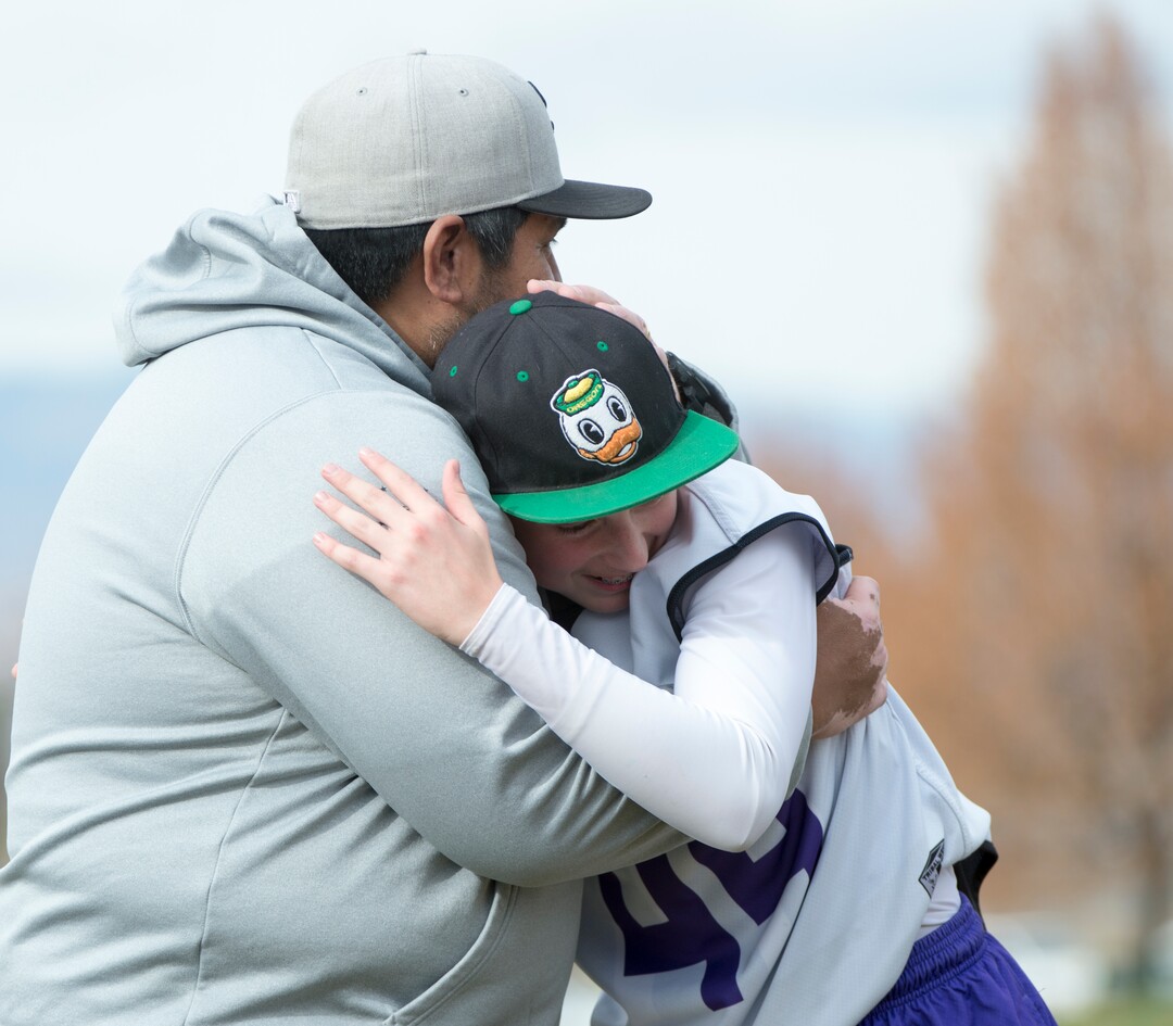 (Rick Egan | The Salt Lake Tribune) Player Seth Linvulle gets a hug from Box Elder lacrosse coach Juan Gaytan during a tournament in Logan on Saturday, Nov. 3, 2018.