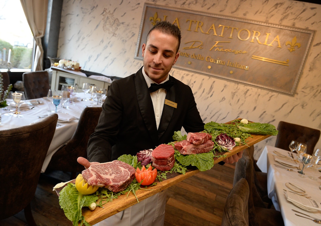 (Francisco Kjolseth  |  The Salt Lake Tribune) Alessandro Maurici, server team leader from Palermo, Sicily, Italy shows off some of the steak offerings at the new La Trattoria di Francesco, the newest Italian concept from the Sicilia Mia chain of restaurants at 1500 S. 1500 East in Salt Lake City.