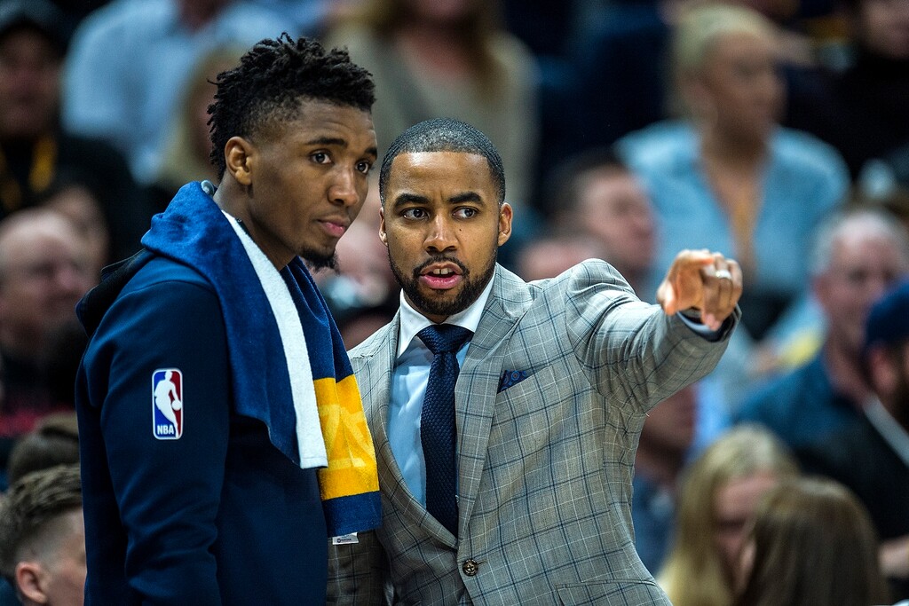 (Chris Detrick  |  The Salt Lake Tribune)  Utah Jazz assistant coach Johnnie Bryant talks with Utah Jazz guard Donovan Mitchell (45) during the game at Vivint Smart Home Arena Friday, January 19, 2018.  